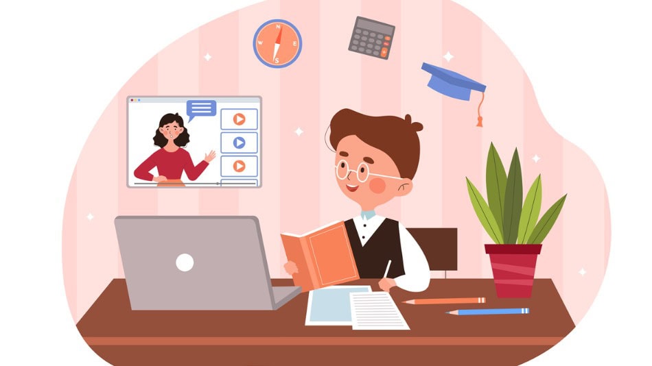 Niño está sentado detrás de su escritorio estudiando en línea usando un ordenador